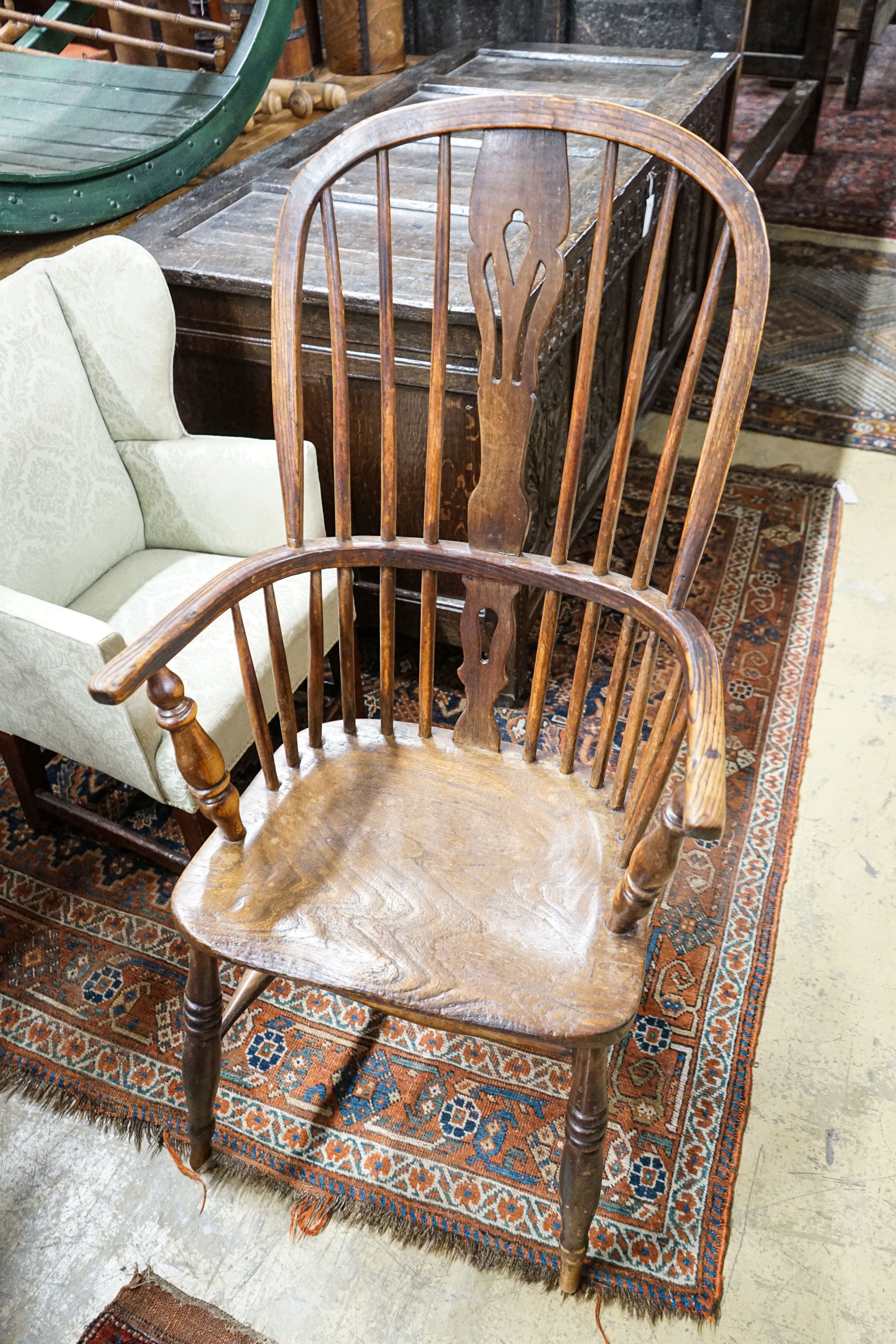 A harlequin set of four Victorian Windsor chairs, comprising near pair of yew, beech and elm, with crinoline stretchers and two others in oak, elm and ash with H stretchers